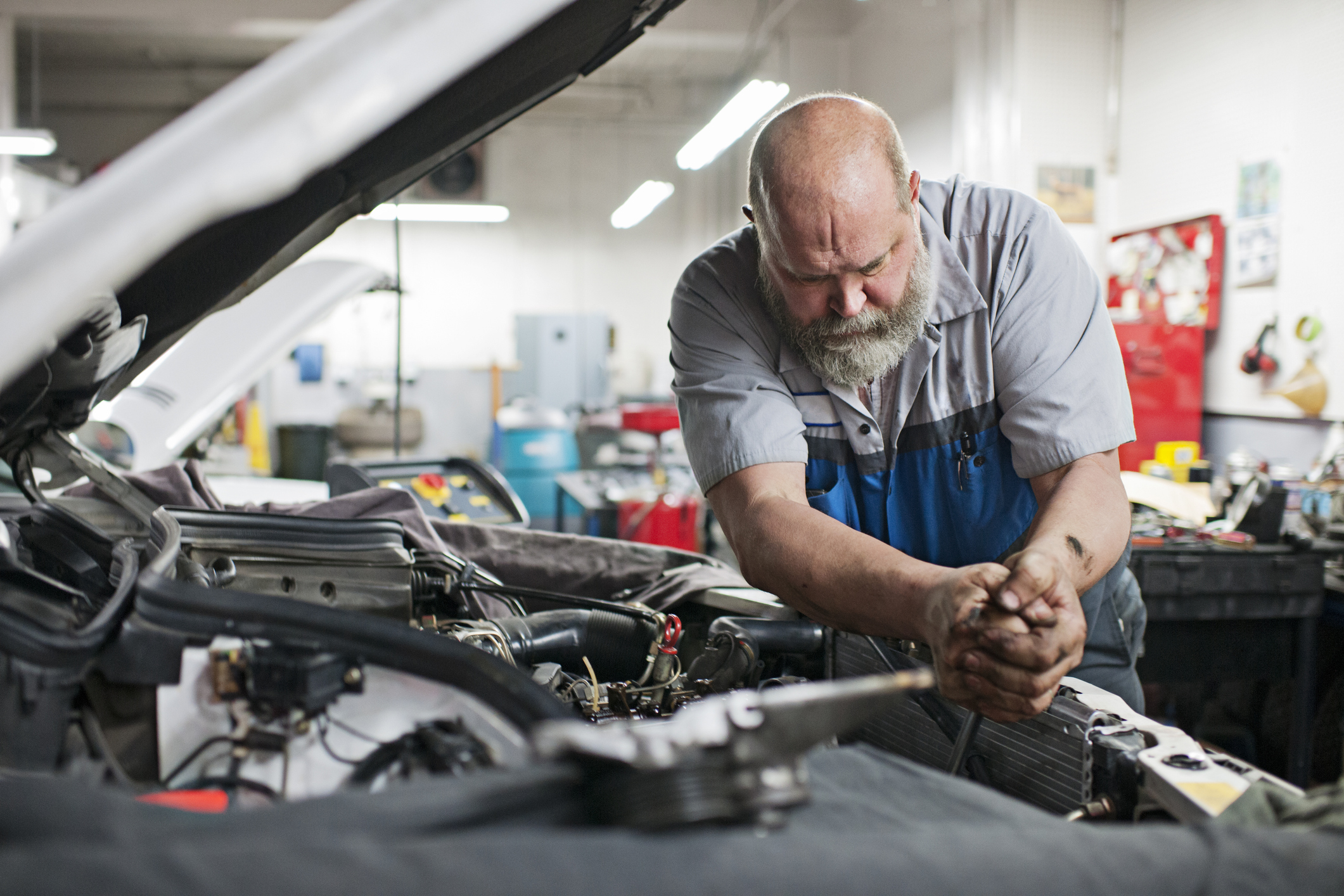 Mechanic uses force to unlock bolt